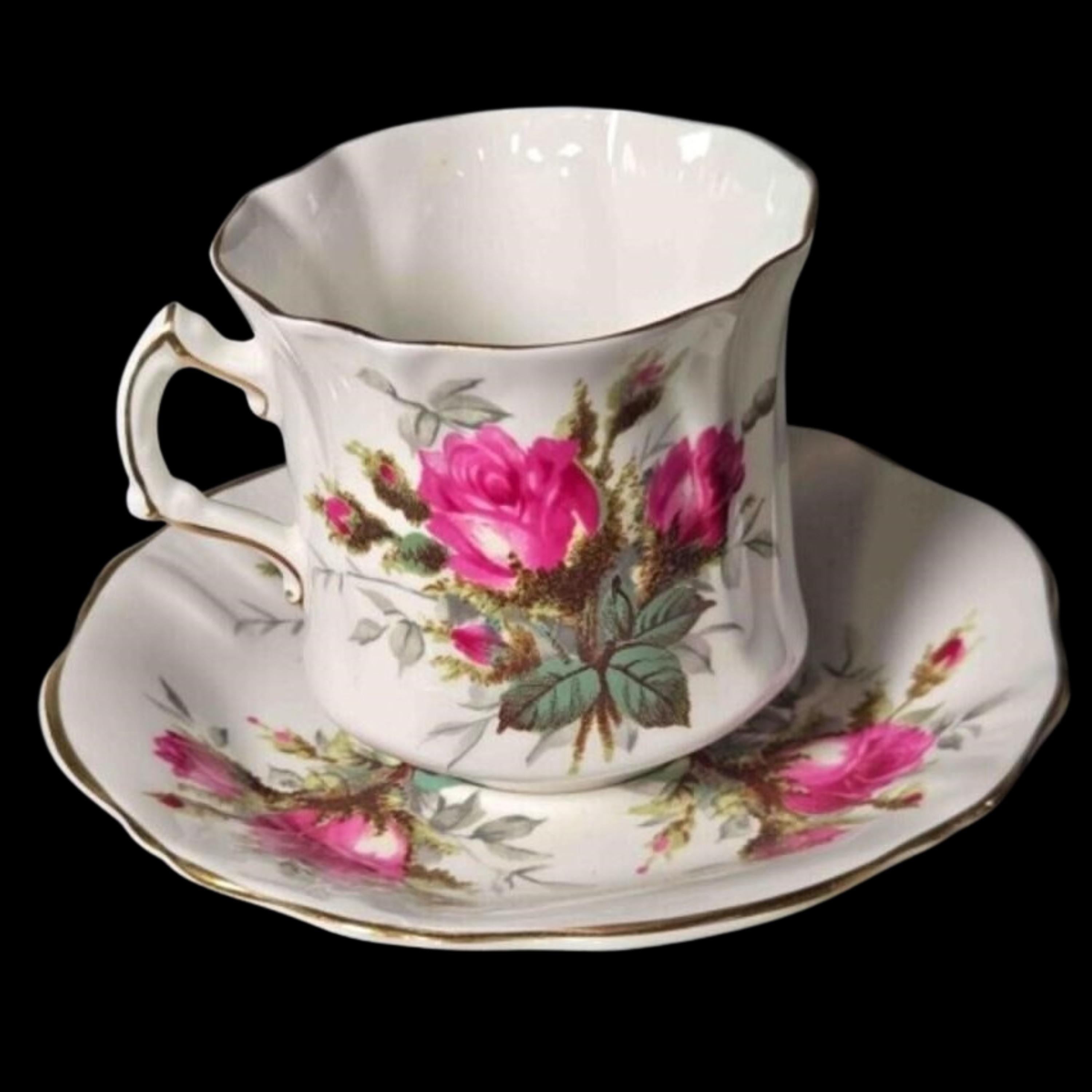 Floral teacup and saucer set on a black background