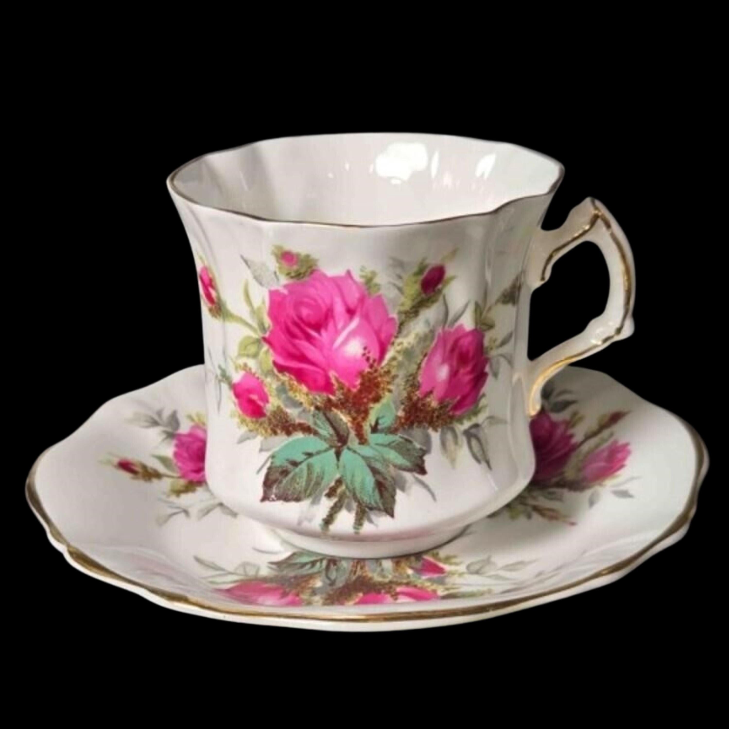 Floral teacup and saucer set on a black background