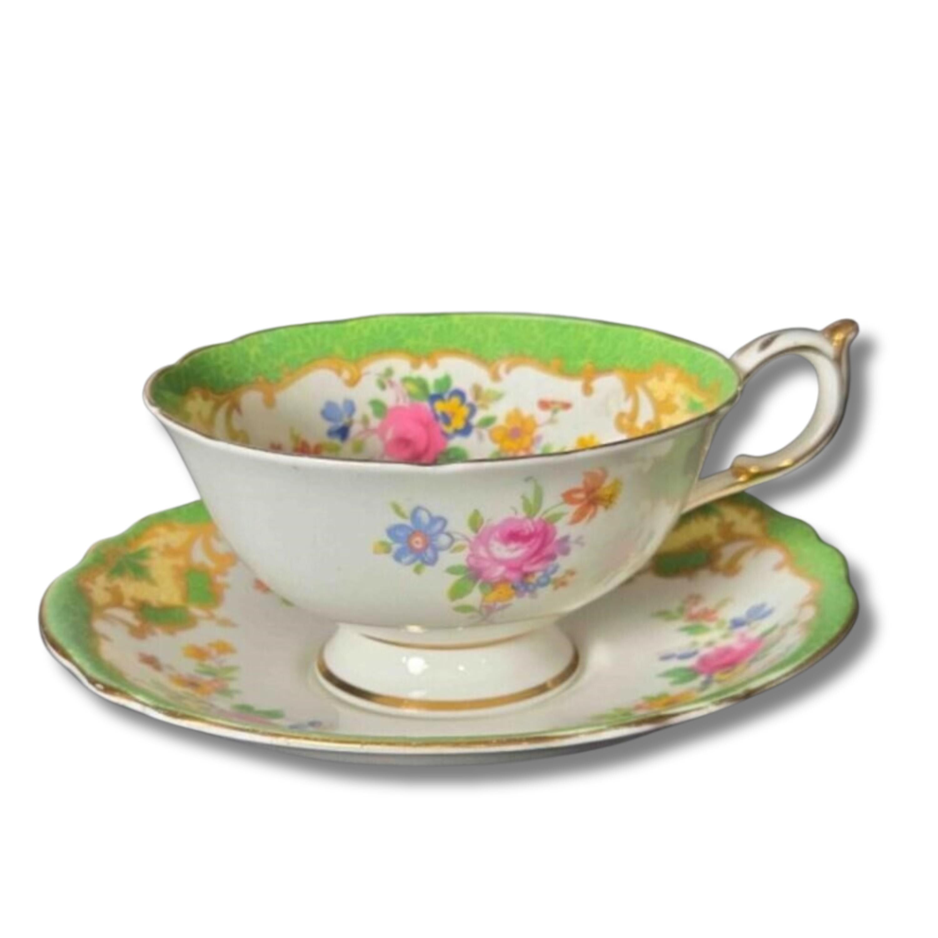 Floral teacup and saucer set on a white background