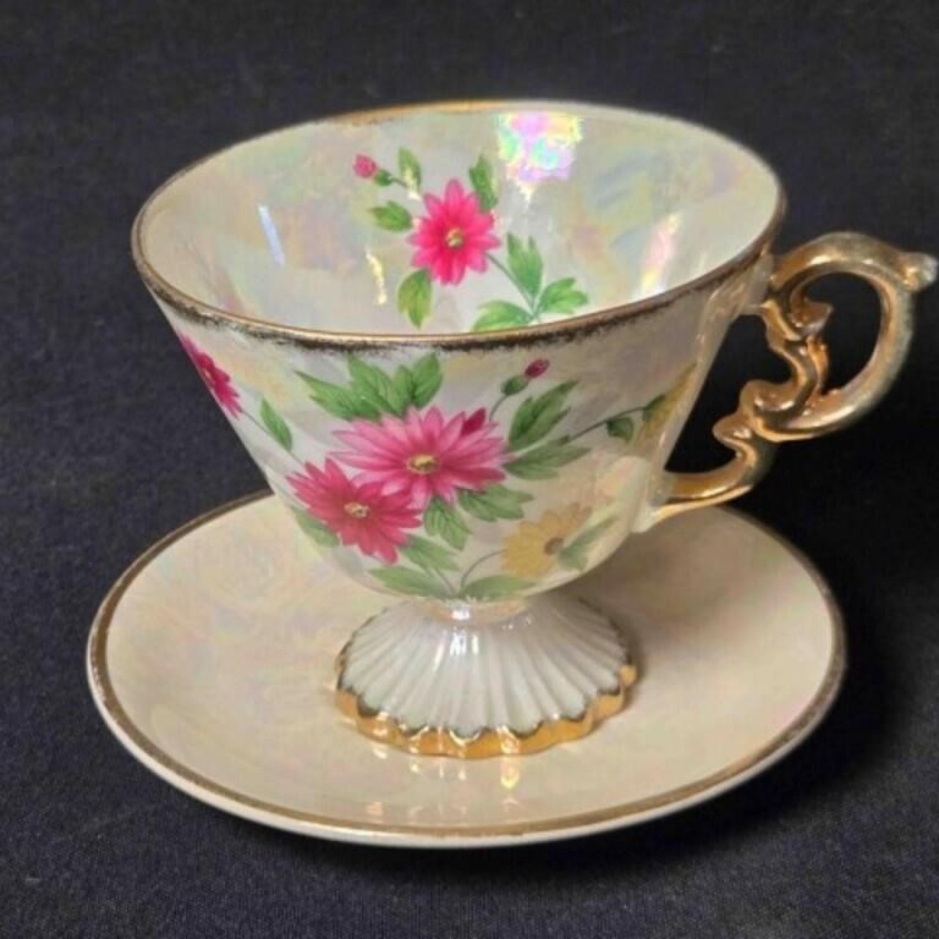 Teacup with floral design on a dark background